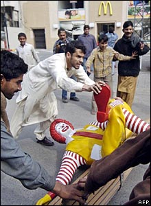 Demonstrators damaged a McDonald's restaurant during Pakistan most violent protests so far over the caricatures.