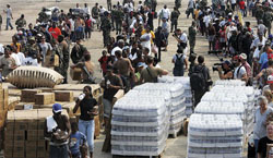 No picnic--but not a riot, either. Starting Monday, Aug. 29--the day levees broke--National Guard troops provided people at the Superdome with FEMA-supplied water and two 3000-calorie Meals Ready to Eat (MRE) food packets per day. PHOTOGRAPH BY MARIO TAMA/GETTY IMAGES