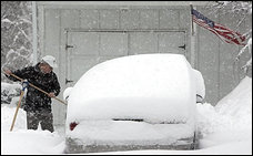 Bill Trautwein starts to shovel his way to his snow-covered car in South Brunswick, N.J., as a winter storm hit Sunday, Feb. 12, 2006. A major storm slammed the mid-Atlantic and Northeast states with nearly 2 feet of windblown snow on Sunday, nearing record levels as it blacked out thousands of customers and shut down air travel from Washington to Boston. (AP Photo/Mike Derer) (Mike Derer - AP)